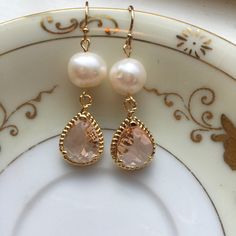 Gold Freshwater Pearl Champagne Blush Earrings Pink Peach Jewelry - Bridesmaid Earrings - Wedding Jewelry Earrings measure approximately 1.5 inches long and are made with 14k gold filled earwires. Can be made in silver. Shipped in a gift box for easy gift giving. Delicate Gold Earrings For Bridal Shower, Gold Earrings For Bridal Shower, Delicate Jewelry With Matching Earrings For Bridal Shower, Rose Gold Teardrop Pearl Earrings For Wedding, Rose Gold Dangle Pearl Earrings For Wedding, Elegant Peach Dangle Earrings, Gold Teardrop Bridesmaid Jewelry, Gold Teardrop Jewelry For Bridesmaids, Elegant Gold Earrings For Bridesmaids