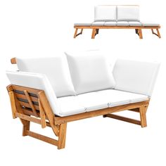 two white couches with wooden frames and pillows