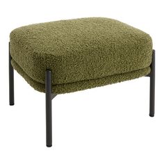 the footstool is made out of sheep's wool and has black metal legs