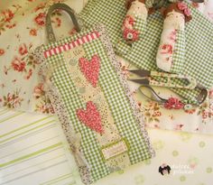 two green and white checkered bags with flowers on them, one has a pair of scissors in it