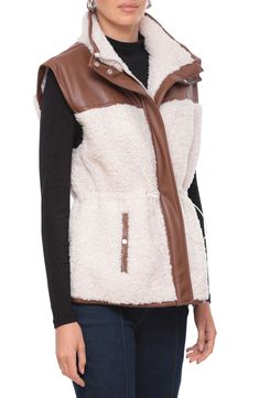 Fluffy faux shearling brings cozy comfort to this versatile faux-leather vest furnished with  handy snap pockets and a drawstring waist to cinch the silhouette. Front zip closure Stand collar Front snap-welt pockets Drawcord-toggle waist 100% polyester with polyurethane coating with 100% polyester faux-shearling contrast Dry clean Imported Faux Leather Vest, Outerwear Vest, Leather Vest, Sherpa Lined, Comforters Cozy, Outerwear Women, Womens Vest, Stand Collar, Drawstring Waist