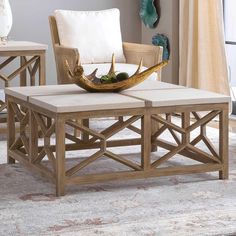 a coffee table sitting on top of a rug in a living room