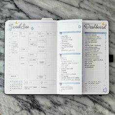 an open planner book on top of a marble counter with the words workbook written in cursive writing