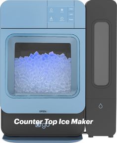 the counter top ice maker is blue and has an ice block pattern on it's front