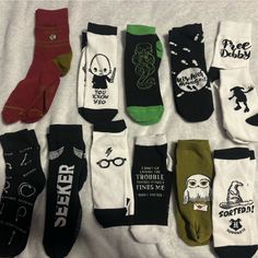 a bunch of socks that are sitting on a bed