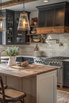 a kitchen with an island and two hanging lights