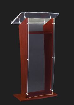 a wooden podium with a clear plastic cover on the top and bottom panel, in front of a black background