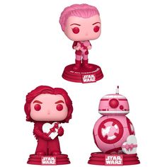 three star wars figurines with pink hair and red clothes, one is holding a heart