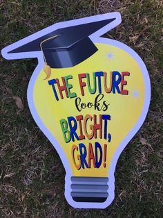 a sign that says the future books is bright, grad on it's side