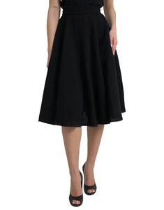 This Dolce & Gabbana skirt has a knee-length cut and sits high on the waist. Made in Italy with 80% virgin wool, 11% silk, and 9% nylon, this black skirt features a back zipper closure. Model: High waist skirt Color: Black Material: 80% Virgin Wool 11% Silk 9% Nylon Back zipper closure Flare Made in Italy Skirt Tops, Black A Line Skirt, High Waist Skirt, Black High Waist, Dolce E Gabbana, Guess Jeans, Knee Length Skirt, Dolce & Gabbana, Cardigan Jacket