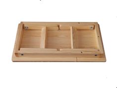 a wooden tray with three compartments on it