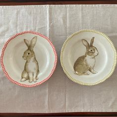 two plates with rabbits painted on them