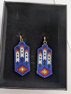 Handmade earrings, made with Delica glass beads. Inspired by the native American culture. Comes in a small gift box. Bead Feather Earrings, Earrings Patterns, Beaded Earrings Patterns, American Culture, Small Gift Boxes, Native American Culture, Earring Patterns, Seed Bead Earrings, Feather Earrings