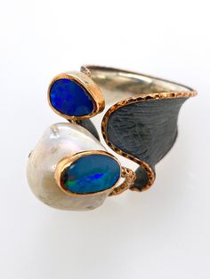 "Wonderful Abstract Artisan Ring! -Handmade with oxidized, textured Sterling silver, bright gold (tests for 10kt) along the edges of the ring and setting for opals -2 bright boulder opals bezel set, one surrounds a huge fresh water pearl -Ring is hallmarked \"M\" and \"925\" -Ring size 8.25 -Face of ring measures .8\" x .9\", depth of ring .7\" -Opals measure about 10mm x 6mm and 9mm x 6mm.  Large pearl measures roughly 13mm in diameter -Total weight 19.1g -Ring is in excellent, new condition Ad Artisan Oxidized Finish Rings For Anniversary, Artisan Rings With Oxidized Finish For Anniversary, Opal Band, Freshwater Pearl Ring, Artisan Rings, Handcrafted Artisan Jewelry, 925 Ring, Fresh Water Pearl, Bright Gold