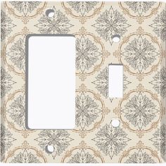 a decorative light switch plate cover with an ornate design on the front and back sides