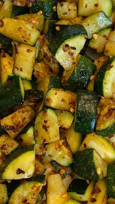 cooked zucchini and squash on a plate with seasoning sprinkles