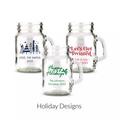 three glass mugs with the words holiday designs in red, white and green on them