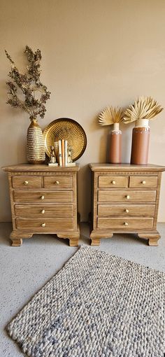 two wooden dressers sitting next to each other on top of a carpeted floor