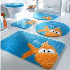 bathroom rugs with cartoon fish on them in blue and orange colors for children's rooms