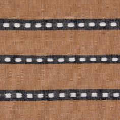 a brown and black striped fabric with white dots on the side, as if it were woven