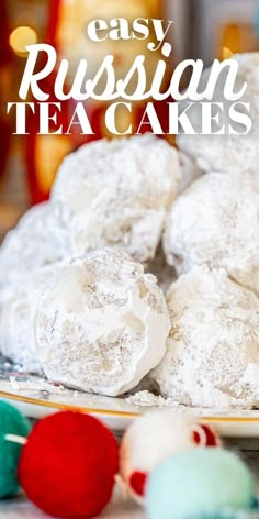 russian tea cakes on a plate with the words easy russian tea cakes in front of it