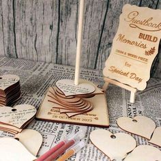 some wooden hearts are sitting on top of a table