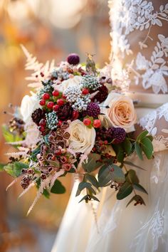 a bridal holding a bouquet of flowers