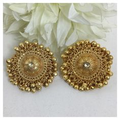 *PRODUCT DETAIL* *Material: Brass *Plating: 22K Antique Gold Plated *DIMENSIONS * *Earrings: Weight: 22 gm each, Length: 4 Inches, Width: 1.7 Inches *ABOUT PRODUCT* *Exclusive 22K Antique Gold Plated Stud Earrings in Antique Design. *Style Tip: Team It with Daily your Formal Indian Attire. *DISCLAIMER* *Product & color may slightly vary due to photographic lighting sources or your screen settings. Traditional 22k Gold Bridal Earrings For Festive Occasions, Temple Jewelry Chandbali Plug Earrings For Festive Occasions, Chandbali Temple Jewelry Plug Earrings For Festive Occasions, Festive Chandbali Temple Jewelry Plug Earrings, Gold Temple Jewelry Earrings For Navratri, Gold Plated Chandbali Tikka, Bollywood Brass Chandbalis With Intricate Design, Gold Chandbali Tikka, Gold Plated, Traditional Brass Chandbalis With Meenakari