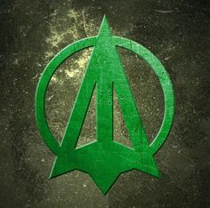 the green arrow symbol is painted on concrete