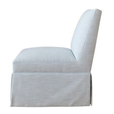 an upholstered white chair on a white background