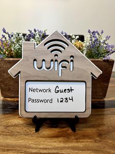 a house shaped plaque with a wifi sign on it