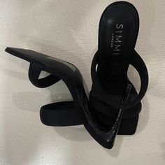 Step Up Your Style With These **Simmi London Mule Heels**Brand New With The Box (No Tag)! Featuring A Chic Square Toe And A Cushioned Top For Added Comfort, These Size 7 Mules Are The Perfect Combination Of Fashion And Functionality. Ideal For Elevating Any Look, Whether You're Dressing Up For A Night Out Or Keeping It Stylish For A Casual Day. Party Black Mules With Heel Loop, Black Synthetic Mules With Padded Heel, Black High Heel Mules With Heel Loop, Black Slip-on Mules With Padded Heel, Simmi Shoes, Designer Black Mules With 4-inch Heel, Mule Heels, London Shoes, Mule