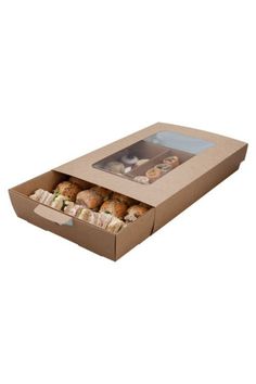 an open cardboard box filled with different types of donuts and muffins on a white background