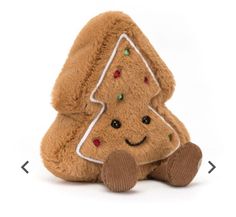 a teddy bear with a christmas tree on its back