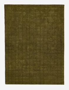 a green rug with squares on it