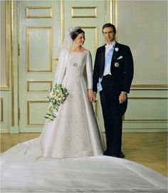 a bride and groom posing for a wedding photo