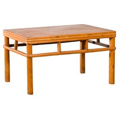 a wooden table sitting on top of a white floor