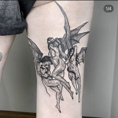 a woman's leg with tattoos on it