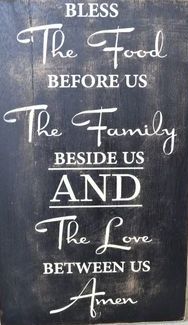 a sign that says, the food before us is the family beside us and the love between us amen