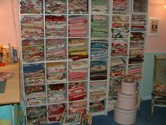 a room filled with lots of different types of fabric