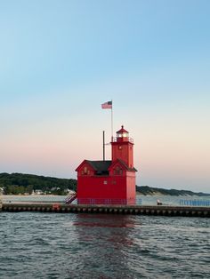 Big red lighthouse overlooking Lake Michigan. Holland Michigan Fall, Lighthouse Aesthetic, Fall Honeymoon, Michigan Lighthouses, Hope College, Michigan Photography, Michigan Summer