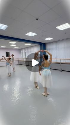 a group of people standing around in a room