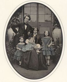 an old black and white photo of a family