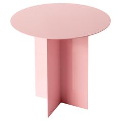 a pink round table with an open section at the top and one corner on the other side