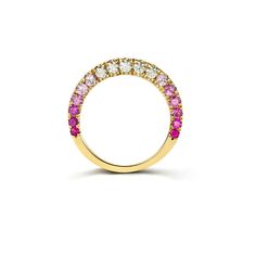 a yellow gold ring with pink and white stones