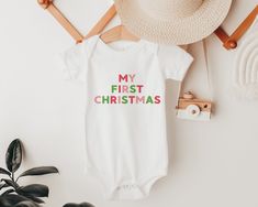 My First Christmas Baby Outfit - a trendy outfit for baby girl or baby boy to wear on Christmas day for a cute photo opportunity, or even as Christmas pajamas on Christmas eve. THE DETAILS: + Made from 100% cotton for the softest feel imaginable + Super soft, lightweight and comfy feel + Professionally printed with eco-friendly inks + Check the size chart in the photos to ensure an accurate fit FIND US ON SOCIAL MEDIA: + Instagram: @milkandcookiesart + Facebook: @milkandcookiesart PRODUCTION & S My First Christmas Onesie, First Christmas Onesie, Baby Christmas Onesie, My First Christmas Outfit, Cute Family Photos, Trendy Christmas Outfits, Christmas Onesie, My First Christmas, Baby Christmas Outfit