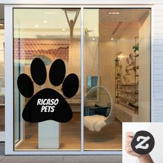 a dog's paw is displayed in the window of a pet store with an ad for ricoso pets