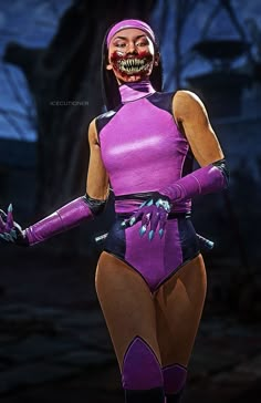 a woman in a purple bodysuit with an evil face on her head and hands