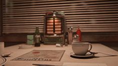 a table topped with cups and saucers next to a window