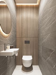 a bathroom with a toilet, sink and mirror on the wall next to each other